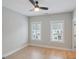 Bedroom featuring hardwood floors and two windows at 1100 Thomas St, Woodstock, GA 30188