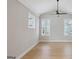 Bedroom featuring hardwood floors, high ceilings, and natural light at 1100 Thomas St, Woodstock, GA 30188