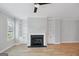 Living room fireplace with built-in shelving and hardwood floors at 1100 Thomas St, Woodstock, GA 30188