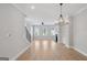 Spacious living room featuring hardwood floors, large windows, and a fireplace at 1100 Thomas St, Woodstock, GA 30188