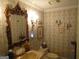 Charming half bathroom with ornate mirror and wallpaper at 5523 Bahia Mar Cir, Stone Mountain, GA 30087