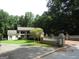 Charming home with a manicured lawn and a stately brick and concrete gated entrance at 5523 Bahia Mar Cir, Stone Mountain, GA 30087