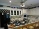 Open kitchen with island and black appliances at 5523 Bahia Mar Cir, Stone Mountain, GA 30087