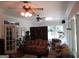 Comfortable living room featuring ceiling fans, hardwood floors, and natural light streaming through windows at 5523 Bahia Mar Cir, Stone Mountain, GA 30087