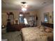Main bedroom with soft lighting, dresser, mirror, a bed with patterned bedding, and decorative accents at 5523 Bahia Mar Cir, Stone Mountain, GA 30087