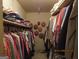 Walk-in closet with ample storage, clothing racks, and shelving for organized wardrobe at 5523 Bahia Mar Cir, Stone Mountain, GA 30087