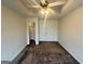 Bedroom featuring a tray ceiling with a ceiling fan, carpet flooring, and closet at 6367 Ellenwood Drive, Rex, GA 30273