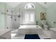 Bathroom featuring glass shower, separate bathtub and marble tile at 150 Tramore Trce, Tyrone, GA 30290