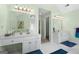 Bright bathroom with double vanity, tile floors, and modern fixtures at 150 Tramore Trce, Tyrone, GA 30290