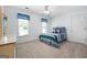 Neutral bedroom with carpet, ceiling fan, and two windows at 150 Tramore Trce, Tyrone, GA 30290