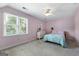 Bedroom with carpet, ceiling fan, and window at 150 Tramore Trce, Tyrone, GA 30290
