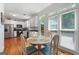 Bright breakfast nook with a table and chairs, situated next to a window and door for seamless indoor-outdoor living at 150 Tramore Trce, Tyrone, GA 30290
