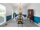 Dining room featuring chair rail detail, chandelier, neutral carpet and natural light at 150 Tramore Trce, Tyrone, GA 30290
