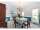 Dining room boasts chandelier, carpet and chair rail detail at 150 Tramore Trce, Tyrone, GA 30290