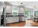Bright eat-in kitchen with stainless steel appliances, access to deck and wooden floors at 150 Tramore Trce, Tyrone, GA 30290
