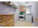 Laundry room with washer, dryer, and cabinets at 150 Tramore Trce, Tyrone, GA 30290