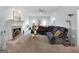 Spacious living room with a fireplace, large sofa, and natural light, perfect for Gathering gatherings at 150 Tramore Trce, Tyrone, GA 30290