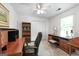 Office featuring carpet, ceiling fan, and wooden furniture at 150 Tramore Trce, Tyrone, GA 30290