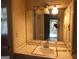 Bathroom featuring a sink, mirror, lighting fixture and access to the screened porch at 3048 Haverford Se Ln, Marietta, GA 30067