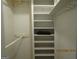 Organized closet featuring multiple shelves and a rod for hanging clothing at 3048 Haverford Se Ln, Marietta, GA 30067