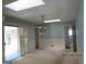 Bright dining room with a modern light fixture, light blue paint, and a sliding door at 3048 Haverford Se Ln, Marietta, GA 30067
