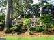A cozy single-story home nestled among mature trees and lush landscaping, offering a private setting at 3048 Haverford Se Ln, Marietta, GA 30067