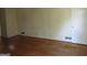 Bright living room with hardwood floors and ample natural light, perfect for entertaining at 3048 Haverford Se Ln, Marietta, GA 30067
