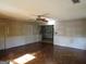 Cozy living room showcasing hardwood floors and view into the kitchen at 3048 Haverford Se Ln, Marietta, GA 30067