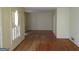 Spacious living area with hardwood floors and large windows, creating a bright and inviting atmosphere at 3048 Haverford Se Ln, Marietta, GA 30067