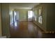 Expansive living area featuring gleaming hardwood floors and neutral walls, offering versatility at 3048 Haverford Se Ln, Marietta, GA 30067