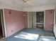 Screened porch featuring a brick wall and a sliding door at 3048 Haverford Se Ln, Marietta, GA 30067