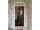 Inviting entryway featuring a modern front door with glass panels, offering a glimpse into the home's interior and dark hardwood floors at 2920 Prestwood Dr, Cumming, GA 30040