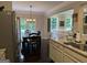 Modern kitchen with stainless steel appliances, granite countertops, and an open layout flowing into the dining and living areas at 2920 Prestwood Dr, Cumming, GA 30040