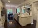 Spacious kitchen featuring granite countertops, a large island, and views into the dining and living areas for easy entertaining at 2920 Prestwood Dr, Cumming, GA 30040