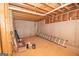 Unfinished basement with concrete floor, exposed framing, exposed pipes, and a white brick foundation at 65 Cold Harbor Ct, Sharpsburg, GA 30277