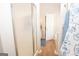 Bathroom features a glass shower and leads into a well-organized walk-in closet at 65 Cold Harbor Ct, Sharpsburg, GA 30277