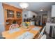 Cozy dining area with a wooden table, chairs, and a decorative hutch at 65 Cold Harbor Ct, Sharpsburg, GA 30277