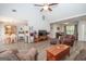 Spacious living room with hardwood floors, fireplace, and ample seating at 65 Cold Harbor Ct, Sharpsburg, GA 30277