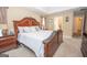 This main bedroom boasts a tray ceiling, carpet floors, and an ensuite bathroom at 65 Cold Harbor Ct, Sharpsburg, GA 30277