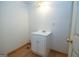 Small room with laminate floor, a single sink, a vanity cabinet, white walls, and an access door at 65 Cold Harbor Ct, Sharpsburg, GA 30277