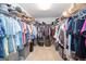 Large walk-in closet is well-organized and has custom shelving for optimal storage at 65 Cold Harbor Ct, Sharpsburg, GA 30277