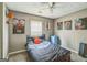 Bedroom with carpet, decorative sport posters, and modern ceiling fan at 447 Sherwood Cir, Stone Mountain, GA 30087
