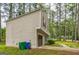 The side of the home features the garage entrance and a sidewalk leading to the front at 447 Sherwood Cir, Stone Mountain, GA 30087