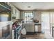 Functional kitchen with stainless steel appliances, modern countertops, and ample cabinet space at 447 Sherwood Cir, Stone Mountain, GA 30087