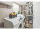 Functional laundry room features a modern washer and dryer, plus essential utility systems at 447 Sherwood Cir, Stone Mountain, GA 30087
