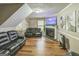 Inviting living room with a fireplace, hardwood floors, and comfortable seating at 447 Sherwood Cir, Stone Mountain, GA 30087