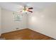 Bedroom with neutral paint, ceiling fan, and a single window for natural light at 6674 Cowan Mill Rd, Winston, GA 30187