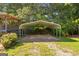 Carport space with metal roof and columns, offering protection for vehicles and equipment at 6674 Cowan Mill Rd, Winston, GA 30187