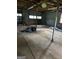 Spacious garage interior with lighting and concrete floor at 6674 Cowan Mill Rd, Winston, GA 30187