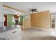 Bright living spaces flow from the kitchen, and boast hardwood floors, and white appliances at 6674 Cowan Mill Rd, Winston, GA 30187